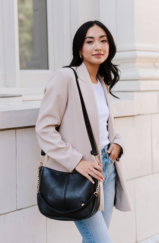 MARISA CROSSBODY SLING PURSE HANDBAGMade from buttery-soft vegan leather and glossy gold hardware, the Marissa Crossbody is the epitome of quiet luxury. This stunning saddle bag transforms seamlessly f