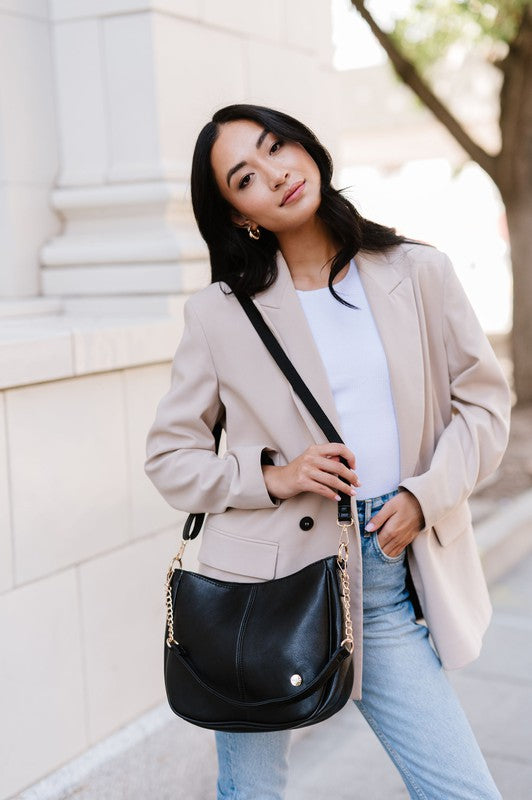 MARISA CROSSBODY SLING PURSE HANDBAGMade from buttery-soft vegan leather and glossy gold hardware, the Marissa Crossbody is the epitome of quiet luxury. This stunning saddle bag transforms seamlessly f