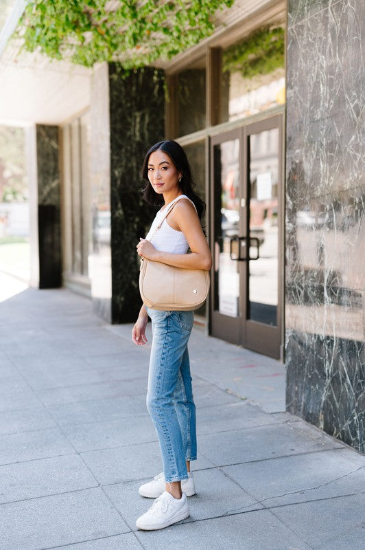 MARISA CROSSBODY SLING PURSE HANDBAGMade from buttery-soft vegan leather and glossy gold hardware, the Marissa Crossbody is the epitome of quiet luxury. This stunning saddle bag transforms seamlessly f