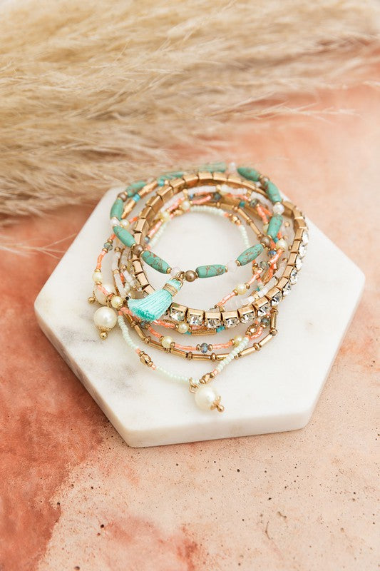 Sweet Pastel Studded Beads Layered Bracelet25% Glass 30% Clay 10% Pearl 10% CCB 10% Brass 10% Iron 5% PolyesterImmediate ShippingHandcrafted in IndiaMaterial Composition: 25% Glass 30% Clay 10% Pearl 10% CCB 