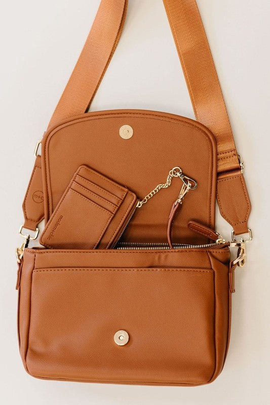 SIGNATURE CROSSBODY SHOULDER BAG WITH CARD WALLETSleek, durable vegan leather material? Check. A matching wallet? Check. Goes-with-everything colors and a chic silhouette? Double check!The Signature Crossbody is fu