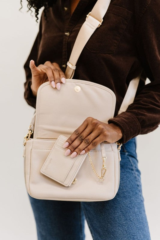 SIGNATURE CROSSBODY SHOULDER BAG WITH CARD WALLETSleek, durable vegan leather material? Check. A matching wallet? Check. Goes-with-everything colors and a chic silhouette? Double check!The Signature Crossbody is fu