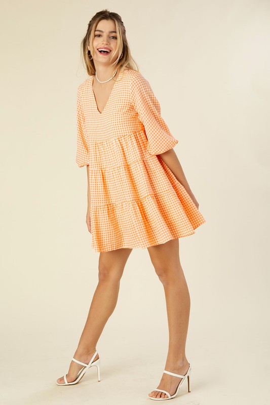 Gingham checked tiered dress- Gingham checked tiered dress- Pattern type : yarn dyed gingham check- Neck line : V neck- Sleeve type : puff sleeves- Sleeve length : 3/4 sleeves- Stretch : no str