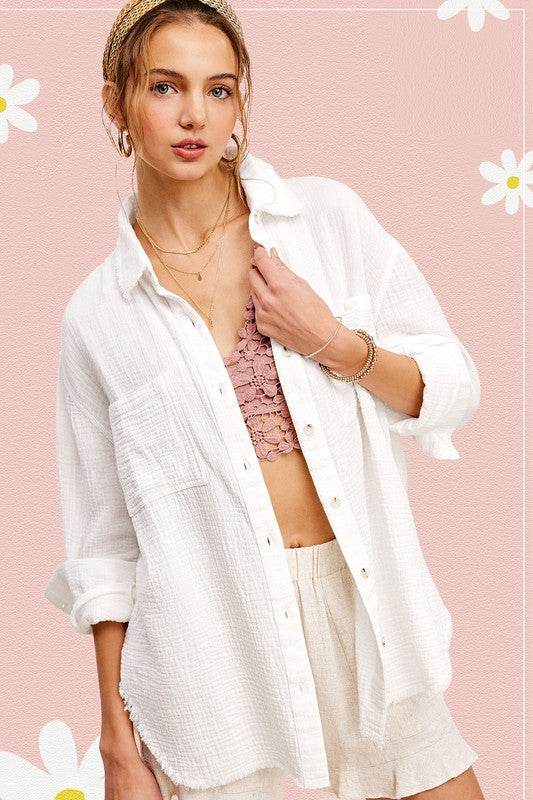 Soft Washed Crinkled Gauze Button Down ShirtSoft washed button down shirt with oversized, slouchy silhouette in a gorgeous crinkled gauze with dual front pockets. The raw hemline makes it the most effortless s