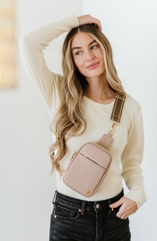 BRIDGET SLING CROSSBODY PHONE CASE BELT BAGIntroducing the Bridget Sling Crossbody-a chic and minimalist vegan leather bag, designed to be the perfect size to carry your daily essentials. Crafted with sleek l