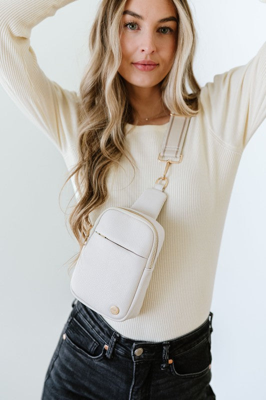 BRIDGET SLING CROSSBODY PHONE CASE BELT BAGIntroducing the Bridget Sling Crossbody-a chic and minimalist vegan leather bag, designed to be the perfect size to carry your daily essentials. Crafted with sleek l