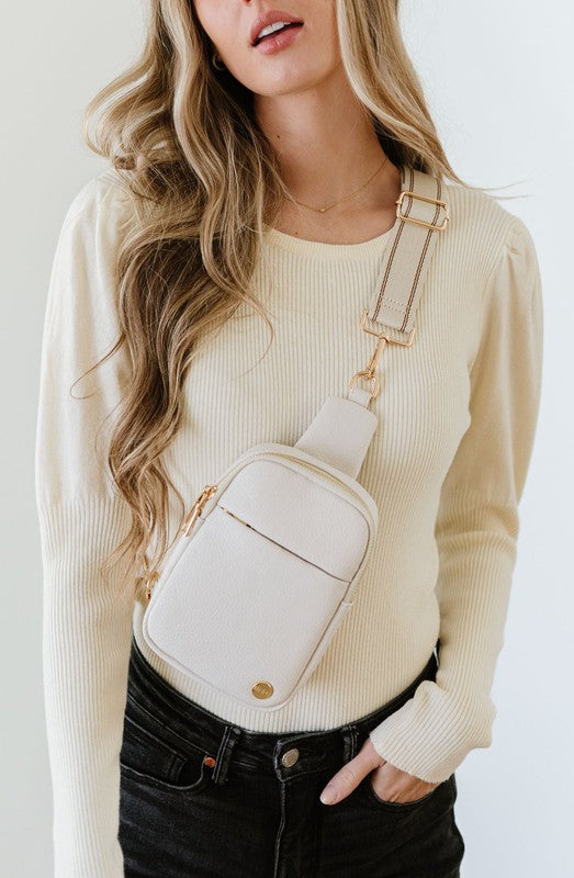 BRIDGET SLING CROSSBODY PHONE CASE BELT BAGIntroducing the Bridget Sling Crossbody-a chic and minimalist vegan leather bag, designed to be the perfect size to carry your daily essentials. Crafted with sleek l