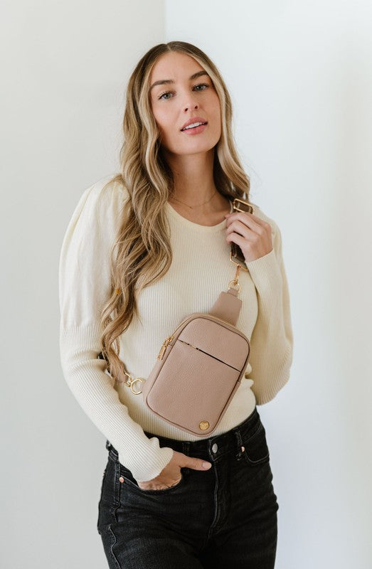 BRIDGET SLING CROSSBODY PHONE CASE BELT BAGIntroducing the Bridget Sling Crossbody-a chic and minimalist vegan leather bag, designed to be the perfect size to carry your daily essentials. Crafted with sleek l