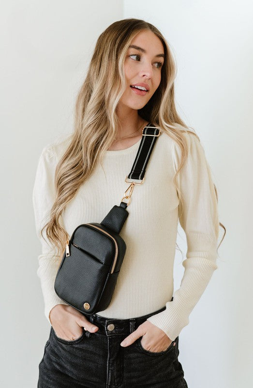 BRIDGET SLING CROSSBODY PHONE CASE BELT BAGIntroducing the Bridget Sling Crossbody-a chic and minimalist vegan leather bag, designed to be the perfect size to carry your daily essentials. Crafted with sleek l