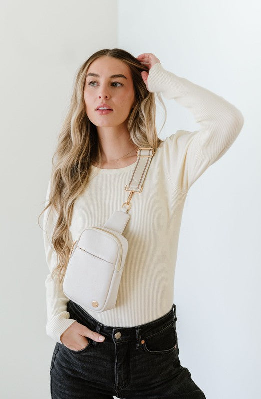 BRIDGET SLING CROSSBODY PHONE CASE BELT BAGIntroducing the Bridget Sling Crossbody-a chic and minimalist vegan leather bag, designed to be the perfect size to carry your daily essentials. Crafted with sleek l