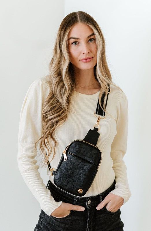 BRIDGET SLING CROSSBODY PHONE CASE BELT BAGIntroducing the Bridget Sling Crossbody-a chic and minimalist vegan leather bag, designed to be the perfect size to carry your daily essentials. Crafted with sleek l