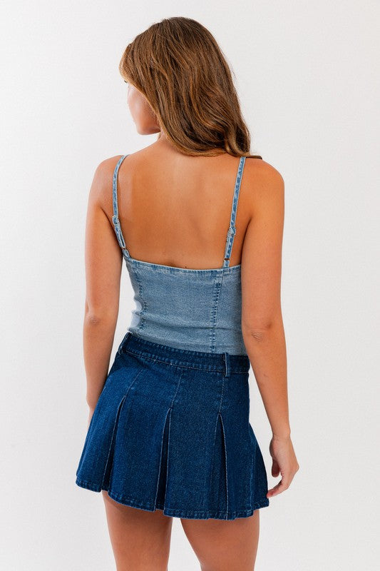 Denim Bustier BodysuitIntroducing our Denim Bustier Bodysuit, a bold and stylish addition to your wardrobe. This bodysuit combines the classic appeal of denim with the allure of a bustier