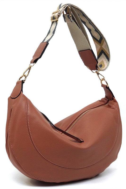 Aztec Guitar Strap Hobo Crossbody BagAztec Guitar Strap Hobo Crossbody Bag Faux vegan leather Zip top closure Gold-tone hardware Detachable shoulder strap L 15 * H 8 * W 2.5