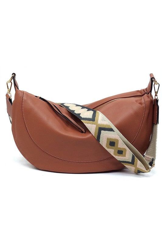 Aztec Guitar Strap Hobo Crossbody BagAztec Guitar Strap Hobo Crossbody Bag Faux vegan leather Zip top closure Gold-tone hardware Detachable shoulder strap L 15 * H 8 * W 2.5