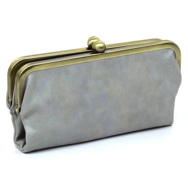 Fashion Kiss Lock Clutch WalletFashion Kiss Lock Clutch Wallet Faux vegan leather Two top frame compartments and is finished with a clasp closure. Lining features three card slots, a zip pocket an