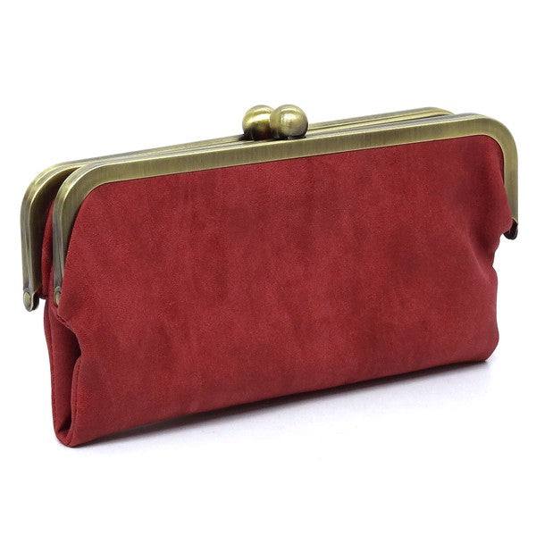 Fashion Kiss Lock Clutch WalletFashion Kiss Lock Clutch Wallet Faux vegan leather Two top frame compartments and is finished with a clasp closure. Lining features three card slots, a zip pocket an