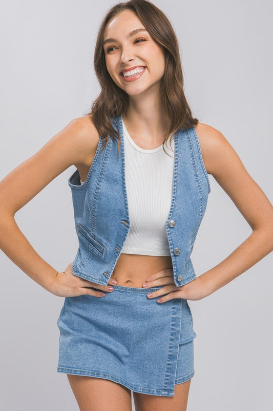 Denim Buttoned Vest TopThe Denim Buttoned Vest Top is a versatile and stylish addition to your wardrobe. Made from durable denim fabric, this top features a button-down front and a sleevel