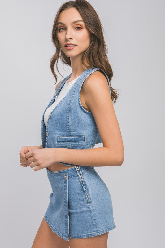 Denim Buttoned Vest TopThe Denim Buttoned Vest Top is a versatile and stylish addition to your wardrobe. Made from durable denim fabric, this top features a button-down front and a sleevel