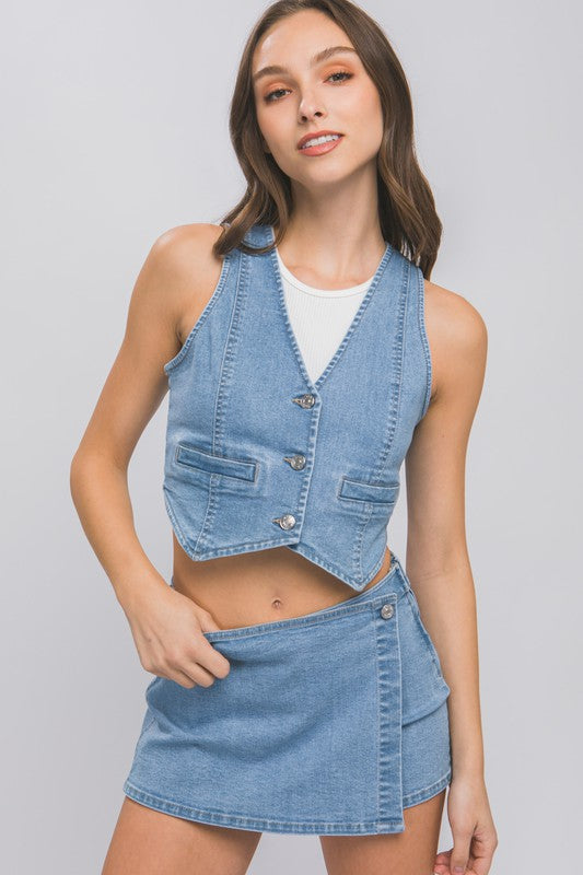 Denim Buttoned Vest TopThe Denim Buttoned Vest Top is a versatile and stylish addition to your wardrobe. Made from durable denim fabric, this top features a button-down front and a sleevel