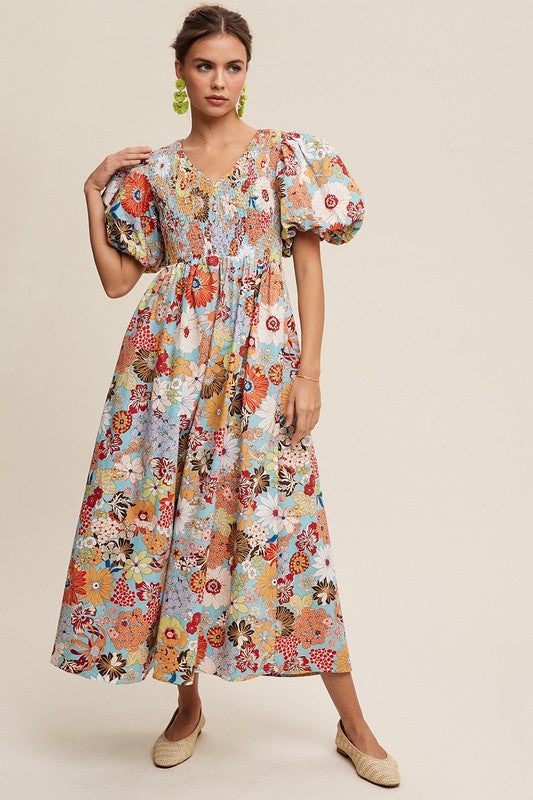 Flower Print Smocked V-neck Puff Sleeve Maxi DressThe Flower Print Smocked V-Neck Puff Sleeve Poplin Maxi Dress exudes charm and elegance with its delightful features. Its V-neckline adds a touch of sophistication, 