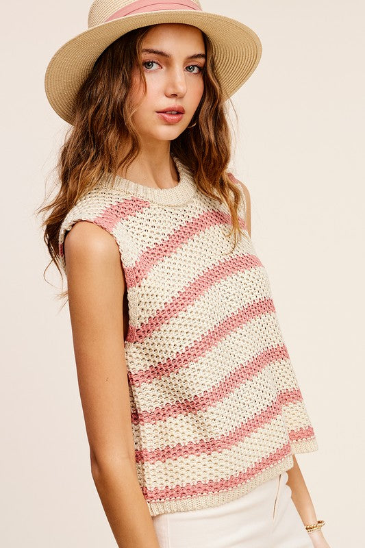 Chunky Stripe Sleeveless Sweater TopThis stripe pullover is featured in a chunky knit fabrication with relaxed fit. The true definition of an effortless essential, this staple pullover is the perfect p