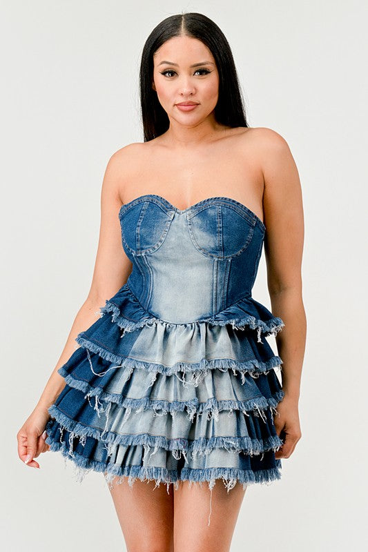 Denim Delight Tiered Ruffle DressIntroducing the "Denim Delight Tiered Ruffle Dress" - a playful and chic statement piece that combines the casual appeal of denim with the femininity of ruffles. Thi