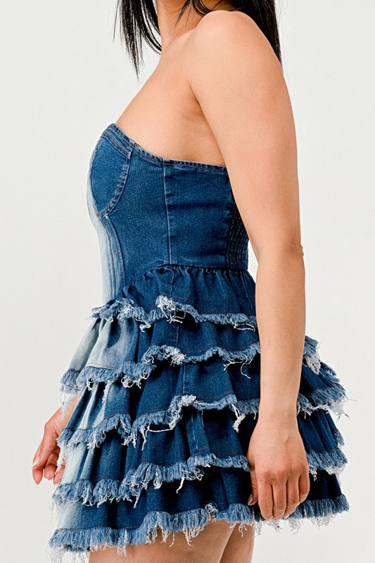 Denim Delight Tiered Ruffle DressIntroducing the "Denim Delight Tiered Ruffle Dress" - a playful and chic statement piece that combines the casual appeal of denim with the femininity of ruffles. Thi