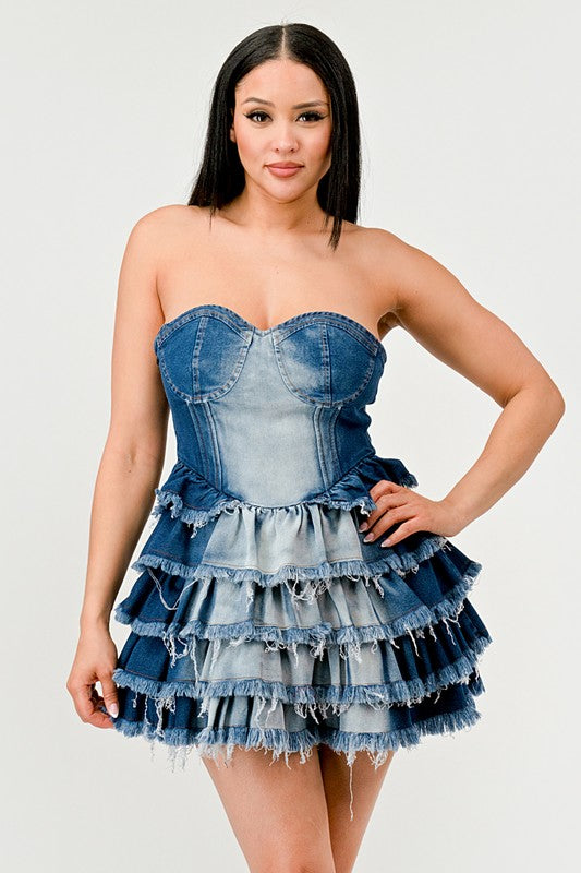 Denim Delight Tiered Ruffle DressIntroducing the "Denim Delight Tiered Ruffle Dress" - a playful and chic statement piece that combines the casual appeal of denim with the femininity of ruffles. Thi