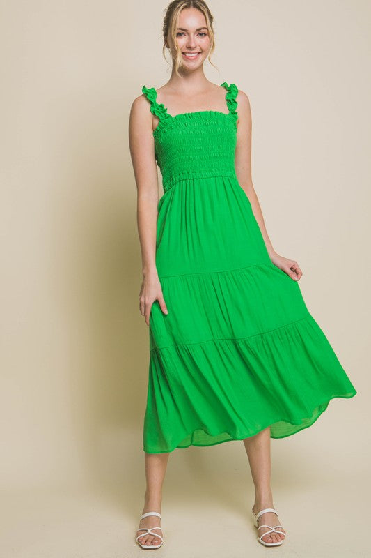 Smocked Bodice Maxi DressThe Smocked Bodice Maxi Dress is a charming and feminine piece perfect for various occasions. Its midi length, elastic strap, and smocked chest ensure a comfortable 