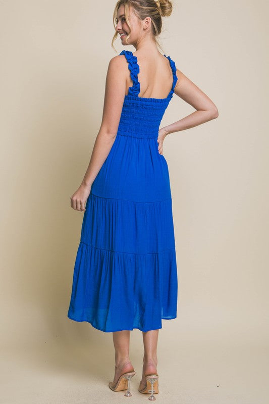 Smocked Bodice Maxi DressThe Smocked Bodice Maxi Dress is a charming and feminine piece perfect for various occasions. Its midi length, elastic strap, and smocked chest ensure a comfortable 