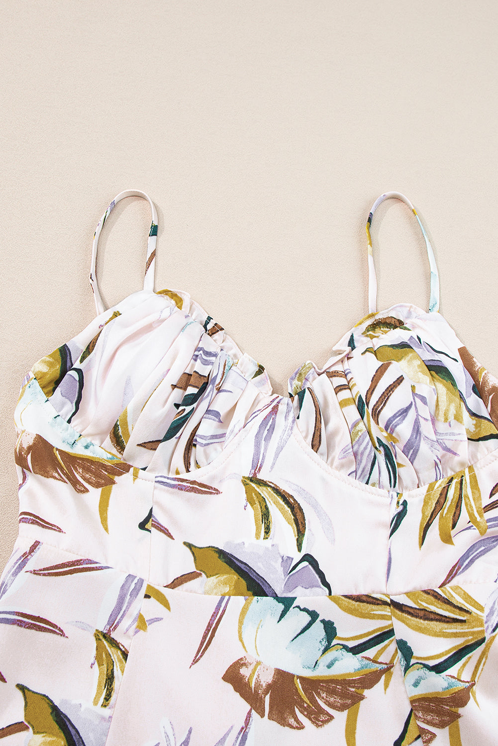 Apricot Tropical Print Spaghetti Straps Cupped DressMaterial:100%Polyester



		The tropical print dress is perfect for summer
	
	
		It’s so sexy with spaghetti straps and slit design
	
	
		Features frilly cup