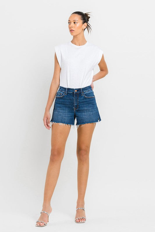 High Rise Slit Raw Hem A-Line ShortsThe High Rise Slit Raw Hem A-Line Shorts combine comfort and style effortlessly. Crafted from comfortable stretch denim, these shorts feature a high-rise waist for a