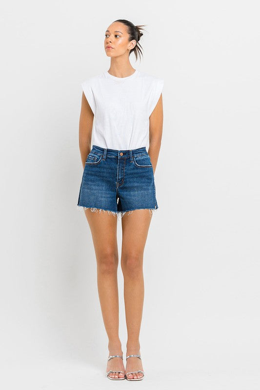 High Rise Slit Raw Hem A-Line ShortsThe High Rise Slit Raw Hem A-Line Shorts combine comfort and style effortlessly. Crafted from comfortable stretch denim, these shorts feature a high-rise waist for a