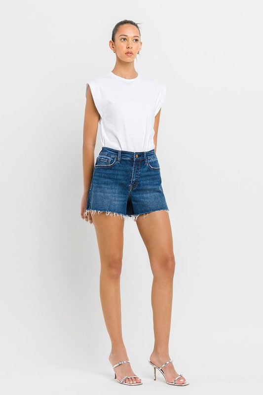 High Rise Slit Raw Hem A-Line ShortsThe High Rise Slit Raw Hem A-Line Shorts combine comfort and style effortlessly. Crafted from comfortable stretch denim, these shorts feature a high-rise waist for a