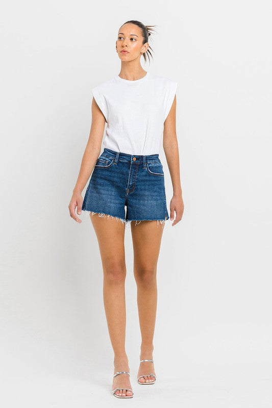 High Rise Slit Raw Hem A-Line ShortsThe High Rise Slit Raw Hem A-Line Shorts combine comfort and style effortlessly. Crafted from comfortable stretch denim, these shorts feature a high-rise waist for a