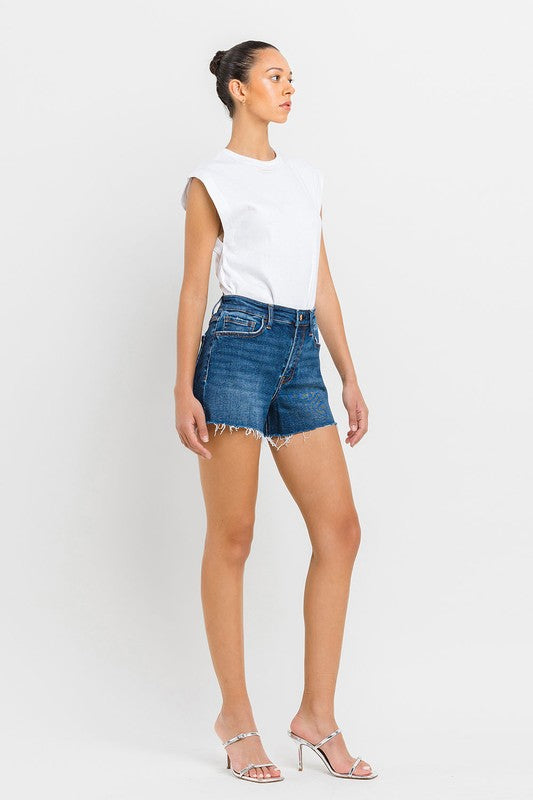 High Rise Slit Raw Hem A-Line ShortsThe High Rise Slit Raw Hem A-Line Shorts combine comfort and style effortlessly. Crafted from comfortable stretch denim, these shorts feature a high-rise waist for a