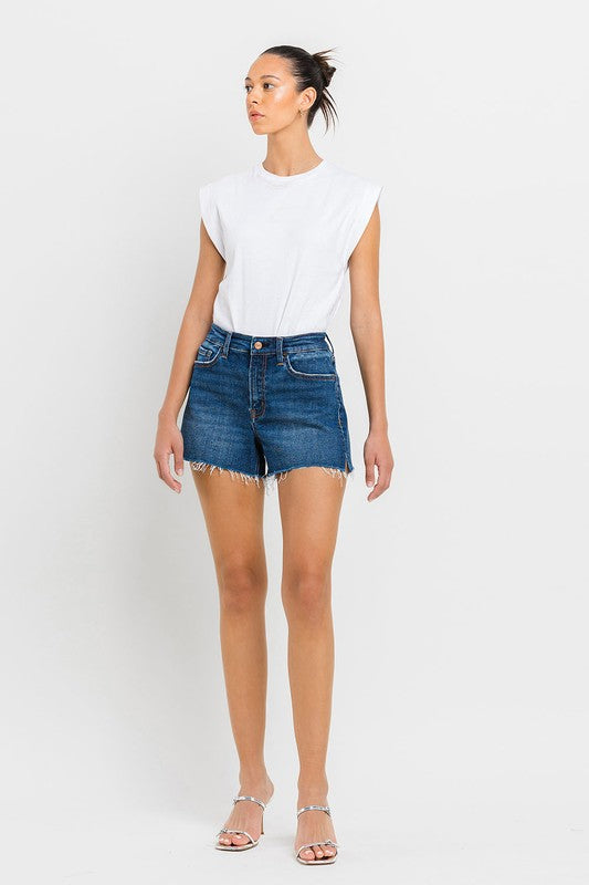 High Rise Slit Raw Hem A-Line ShortsThe High Rise Slit Raw Hem A-Line Shorts combine comfort and style effortlessly. Crafted from comfortable stretch denim, these shorts feature a high-rise waist for a