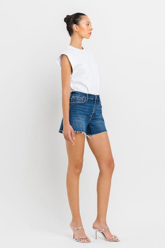 High Rise Slit Raw Hem A-Line ShortsThe High Rise Slit Raw Hem A-Line Shorts combine comfort and style effortlessly. Crafted from comfortable stretch denim, these shorts feature a high-rise waist for a