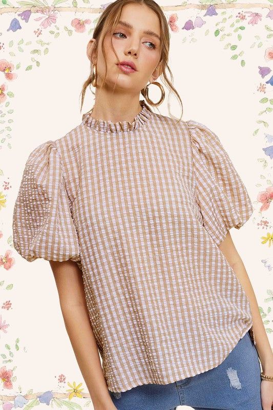 Gingham Check Print Puff Sleeve TopThe Gingham Check Print Puff Sleeve Top exudes femininity and charm with its playful design and swingy silhouette. Crafted from a lightweight and textured gingham ch