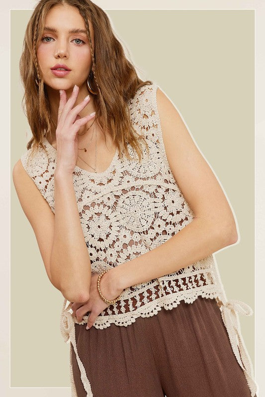 Self Side Tie Detailed Crochet Vest TopStay effortlessly stylish and cool with the Self Side Tie Detailed Crochet Vest Top. This chic addition to your wardrobe features a sleeveless silhouette and a flatt