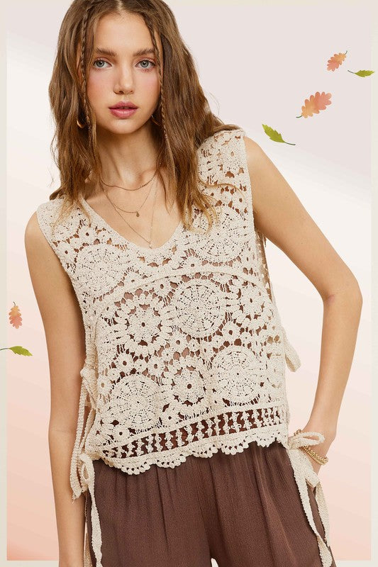 Self Side Tie Detailed Crochet Vest TopStay effortlessly stylish and cool with the Self Side Tie Detailed Crochet Vest Top. This chic addition to your wardrobe features a sleeveless silhouette and a flatt