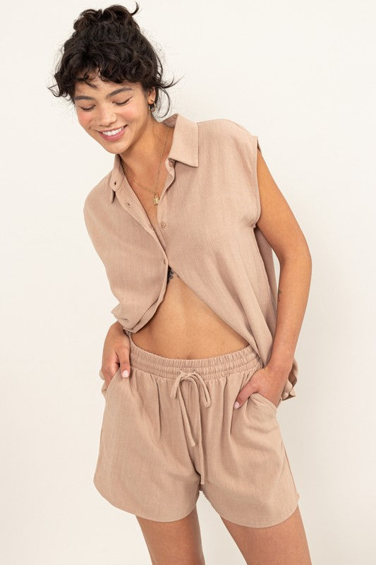 Linen Shirt and Shorts SetElevate your summer style with our Linen Shirt and Shorts Set, designed to make a statement wherever you go. The relaxed shirt features a classic collar, cap sleeves