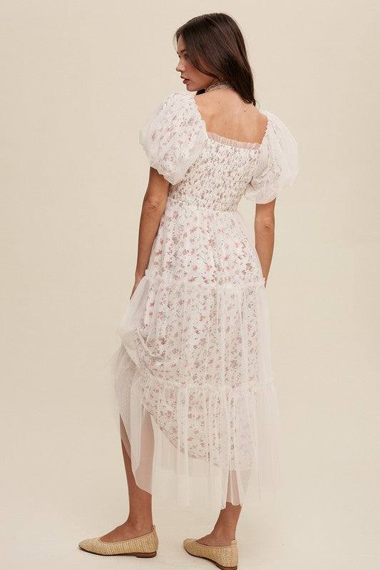 Floral Print and Mesh Puff Sleeve Maxi DressIntroducing our Floral Print and Mesh Puff Sleeve Maxi Dress, a captivating blend of sophistication and charm. This dress features a square neckline adorned with ela