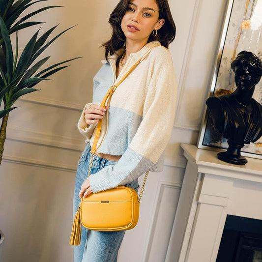 Tassel Small Crossbody Bag Camera BagTassel Small Crossbody Bag Camera Bag 8.75" (W) x 6.5" (H) x 3.25" (D) Tassel zipper Closure Adjustable Shoulder Strap with 22" min to 25" max drop Solid tone faux l