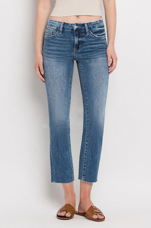 Mid Rise Crop Slim Straight JeansThe Mid Rise Crop Slim Straight Jeans offer a modern take on a classic silhouette. Made from stretch denim, these jeans provide both comfort and style. With a mid-ri