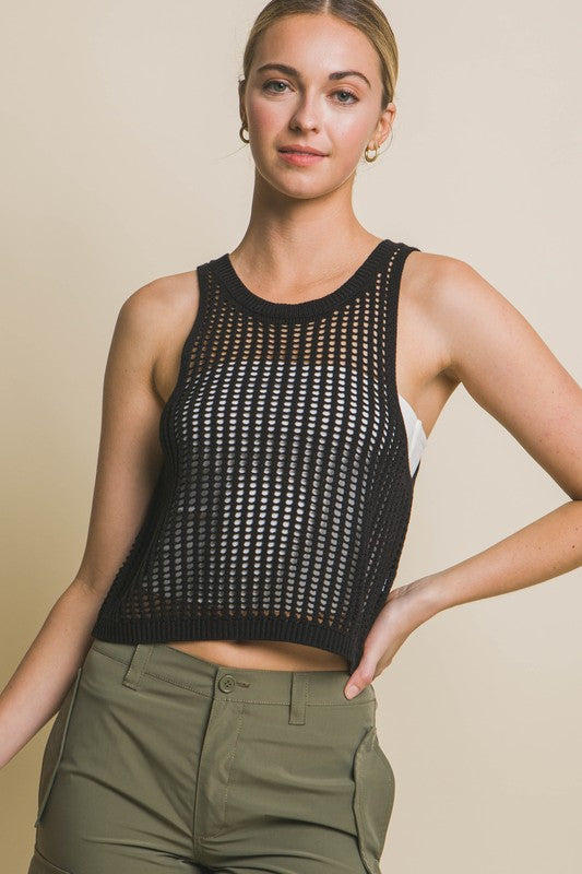 Sleeveless Open Knit Crop TopThe Sleeveless Open Knit Crop Top is a versatile piece that adds a touch of texture to your outfit. Its sleeveless design makes it perfect for warm weather, while th