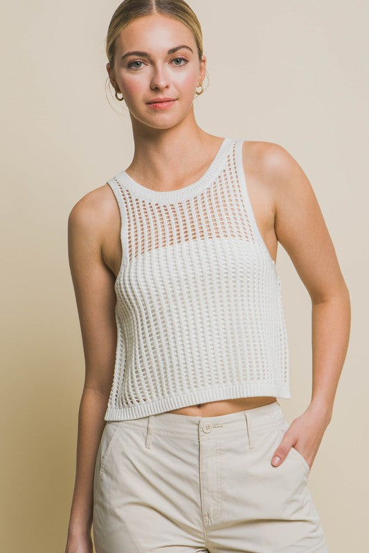 Sleeveless Open Knit Crop TopThe Sleeveless Open Knit Crop Top is a versatile piece that adds a touch of texture to your outfit. Its sleeveless design makes it perfect for warm weather, while th