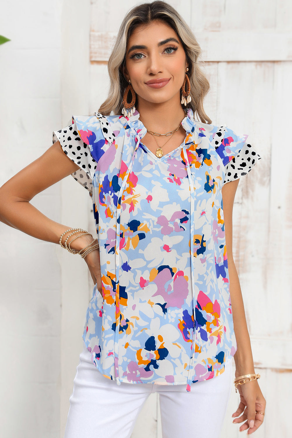 Light Blue Floral Print Ruffle Flutter Sleeve V Neck BlouseMaterial:100%Polyester



		Blouse with vibrant and bold floral print a pretty outlook
	
	
		Feminine ruffled flutter sleeves add a touch of elegance
	
	
		V