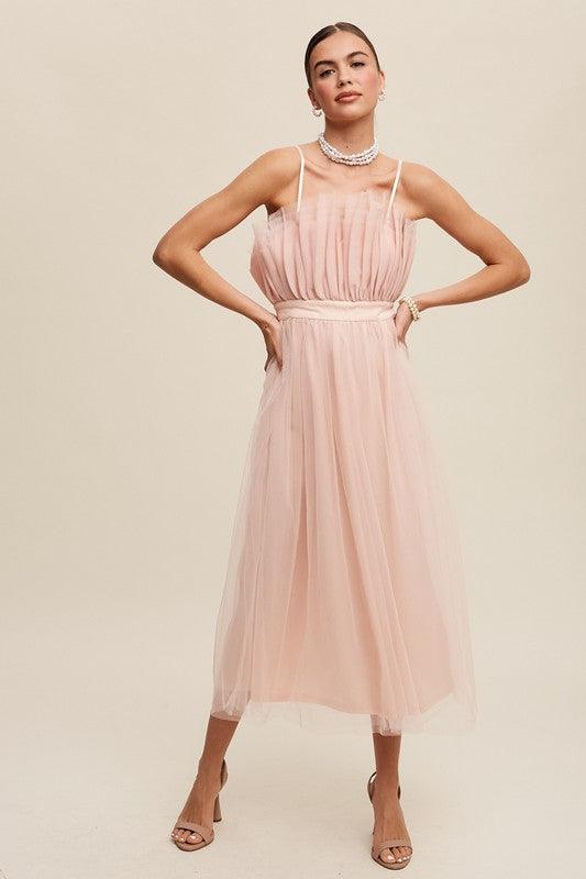 Paper Bag Frill Tulle Maxi DressThe Paper Bag Frill Tulle Maxi Dress exudes elegance and charm with its thoughtful design details. Featuring a removable and adjustable shoulder strap, it offers ver