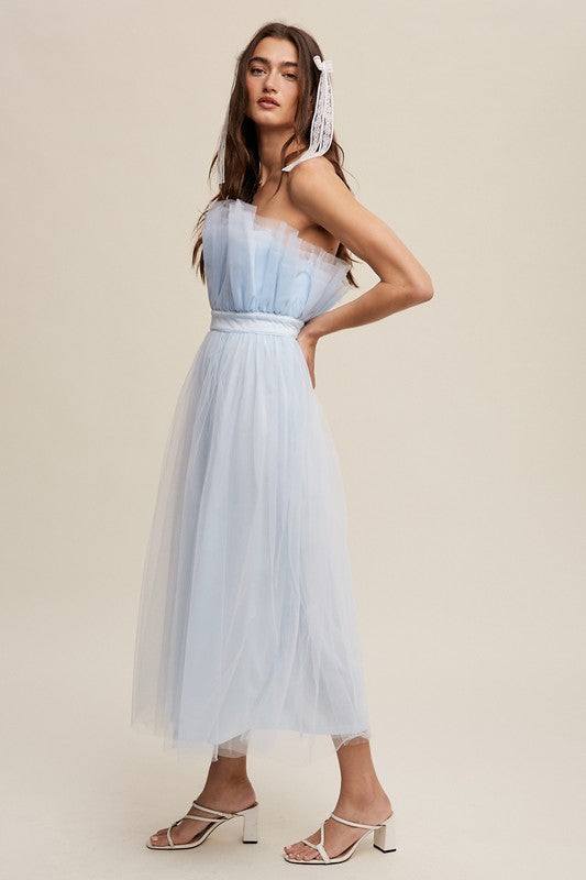 Paper Bag Frill Tulle Maxi DressThe Paper Bag Frill Tulle Maxi Dress exudes elegance and charm with its thoughtful design details. Featuring a removable and adjustable shoulder strap, it offers ver